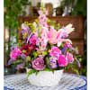 &quot;Burbank in Bloom&quot; is a charming flower arrangement in a woven basket