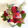This says it all. Large glass cube filled with Hydrangea, Roses, Tulips