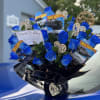 A bold and unique floral gift featuring stunning blue roses and decorative