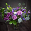 A lovely smokey grey vase holds these shades of lavender, purple and