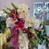 This beautiful Garden Rose Cross Floral Easel Arrangement is the perfect way
