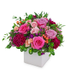 With its lush pinks and purples, this floral arrangement is as classic