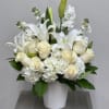 All white assortment of lilies, roses, hydrangeas and stock arranged together with