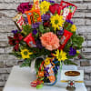 This vibrant and joyful arrangement features a stunning mix of bright, rich