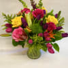 This bright and warm bouquet is arranged with snapdragon, lilies, Roses, solidago