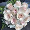 This romantic Bride Bouquet is made with eighteen light pink roses, baby&#039;s