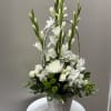 A combination of 7 different types of flowers and greens in a