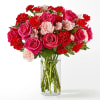 Blushing shades of pink blooms are nestled in lush greens to charm