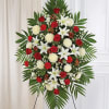 Beautiful red and white floral standing spray for delivery today. Florist arranged
