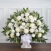 A beautiful sympathy floor basket hand arranged with stunning white flowers. Created