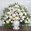 A beautiful sympathy floor basket hand arranged with stunning white flowers. Created