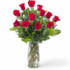 Beautiful arrangement of long stem RED roses arranged in a vase and