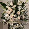A Glorious Farewell, where pure white tube roses, garden roses, and spray