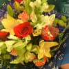 Here is a nice colorful bouquet wrapped in designer paper with a