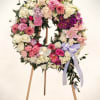 Honor a beautiful life with this elegant standing wreath, thoughtfully designed with