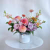 A cheery mix of garden-fresh local flowers such as dahlias, zinnias, snapdragons