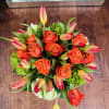 This bouquet is a vibrant celebration of warmth, energy, and elegance. Bursting