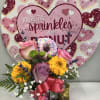 Cute donut mug with pink roses, pink gerbera daisy and baby&rsquo;s breath.