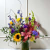 A rich and vibrant arrangement featuring bold tones of burgundy, golden yellow