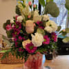 Enjoy a bright bouquet with an assortment of candy for their enjoyment.