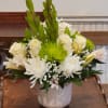 &quot;Soft and elegant, this all-white and green mix features roses, mums, lilies