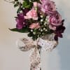 A set of purple and pink roses with purple delights will help
