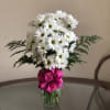 A sparkling glass vase overflowing with sun-kissed daisies is a sure-fire way