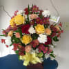 This sweet basket is a perfect combination of roses, carnations and alstroemerias.