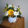 Send your festive congratulations along with this bright, cheery bowl of roses