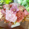 Autumn in pink tones in ceramic container.