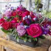Vibrant colors in a variety of blooms arranged in a short design