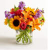 Like a warm embrace, our vibrant bouquet delivers your sentiments to someone