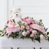 The Touch of Sympathy Casket Spray is a sweet and elegant arrangement
