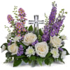 Soft and serene, this artistic array of cream and lavender blooms around
