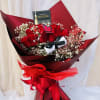Beautiful wrapped bouquet featuring red roses and baby breathe. 