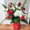This arrangement has Beautiful red roses with amazing white flowers with a