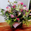 Beautiful roses and tulips in shades of purple with a mix of