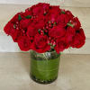 A stunning arrangement of 36 select red roses, artfully designed in a