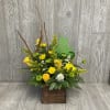 Cute frog arrangement in a wooden box with a metal frog pick