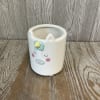 A sweet and sparkly fresh cut flower arrangement. In a keepsake ceramic