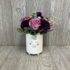A sweet and sparkly fresh cut flower arrangement. In a keepsake ceramic