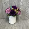A sweet and sparkly fresh cut flower arrangement. In a keepsake ceramic