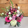The Blushing Meadow arrangement is a vibrant, romantic bouquet that captures the