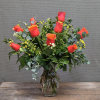 9 exceptional roses arranged in a vase with greens and filler, for