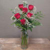 A half dozen red roses with greens and filler. A taller presentation