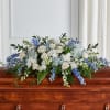 A graceful, full-size tribute, this casket spray features pure white roses symbolizing