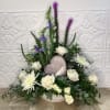 This large floral arrangement, in a white, shallow bowl, is ideal for