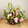Our classically designed funeral basket in soft, pastel tones. Flower selections may
