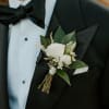 A classic white boutonni&egrave;re that compliments any suit. A perfect addition for