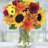 Our Sunshine Celebration Bouquet is a lovely arrangement of sunflowers, roses, lilies